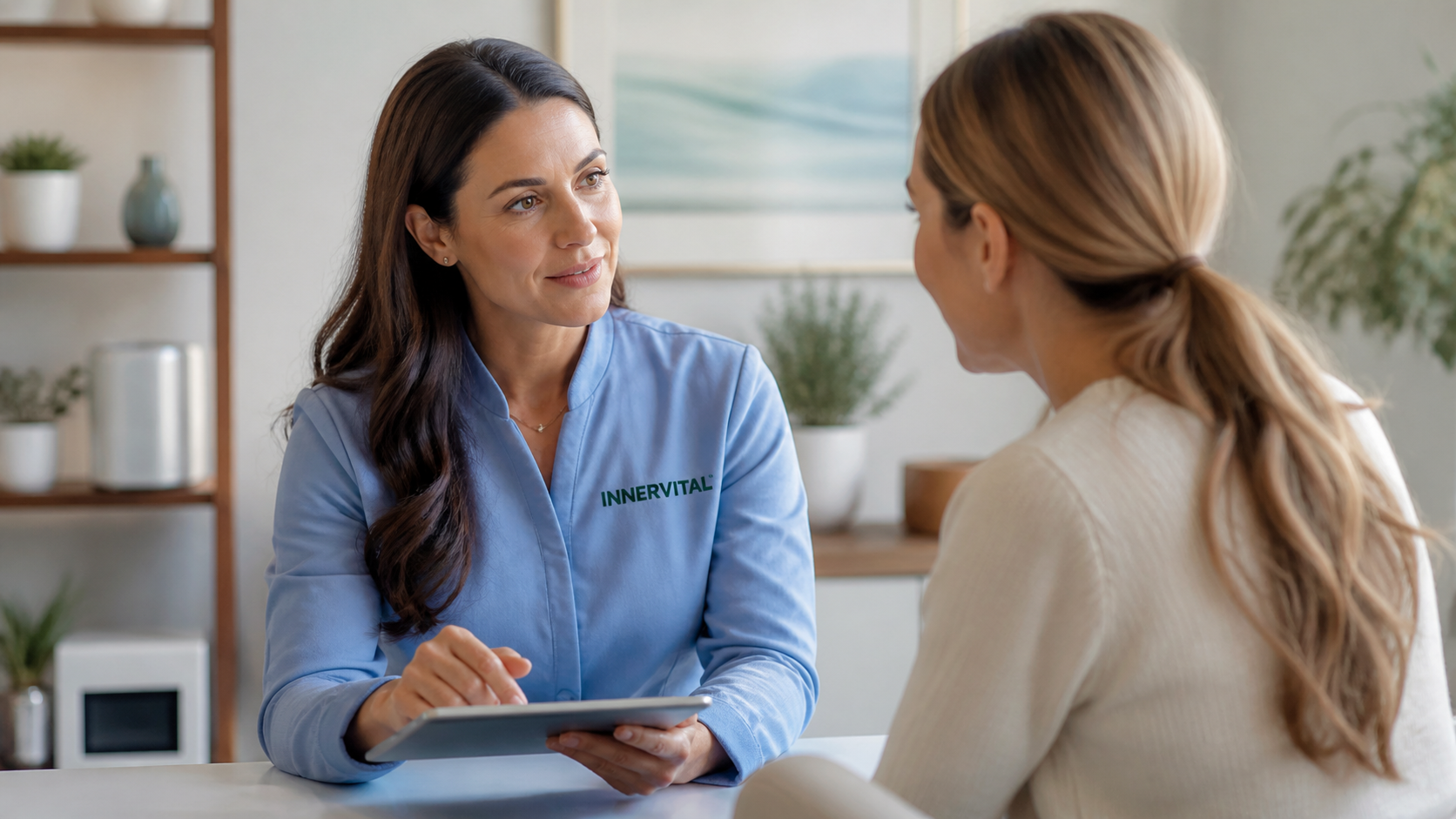 InnerVital functional medicine practitioner consulting with a patient in a calm clinical setting